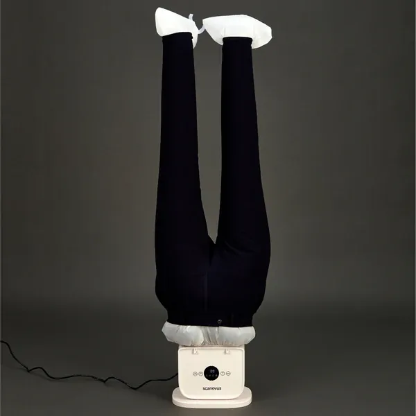 Trousers drying on an automatic ironing machine